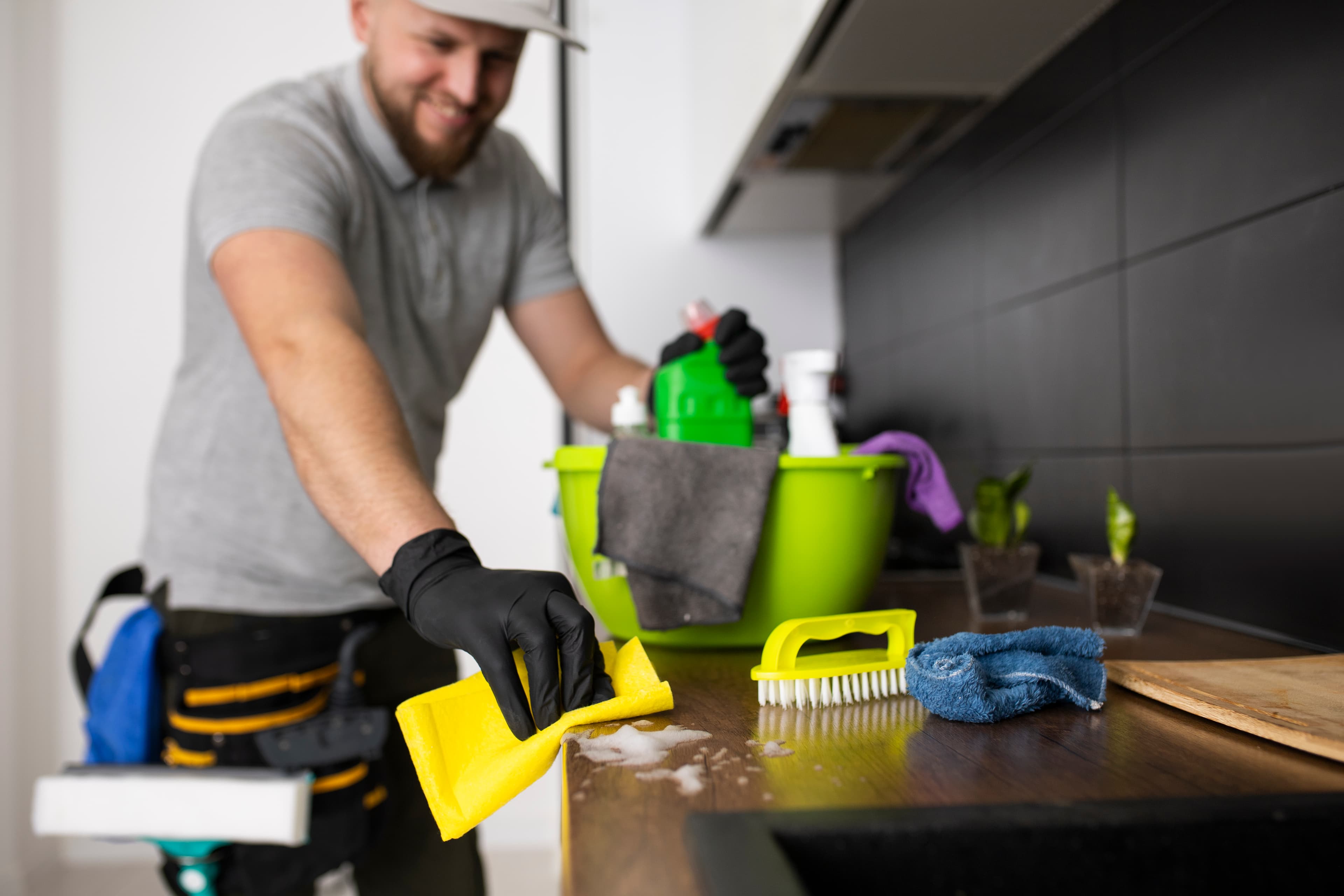 Ottershine cleaning specialist wiping a kitchen counter